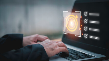 Business planning concept and strategic goal setting and with a businessman pointing at a target icon and checklist. Ideal for success, productivity, project execution and leadership content.