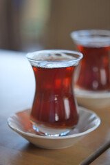Bright turkish tea served in elegant glasses on wooden table