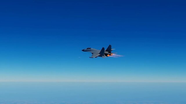 Military fighter jet airplane flying straight forward with jet blast in a blue sky background. Modern military jet airplane.