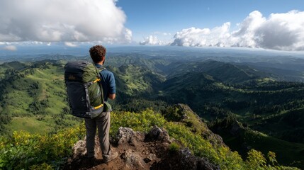 Fototapeta premium Man hiking in mountainous landscape with backpack.