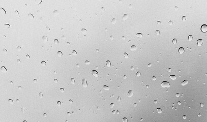 Isolated Transparent Water Droplets with Reflections Captured Against a Clean White Background in a Studio Environment