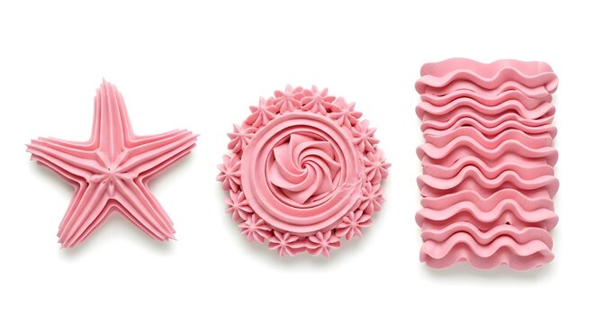 Three pink buttercream frosting shapes including star, swirl, and ripple isolated on white background