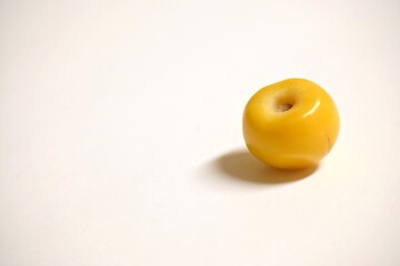 Ripe nance or nanche (Byrsonima crassifolia) over clear background with copy space.