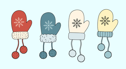 Four cozy winter mittens with snowflake designs and dangling pompoms.