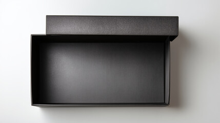 Top down view of open matte black rectangular box, showcasing its smooth interior and elegant design. This high quality box is perfect for packaging gifts or luxury items, evoking sense