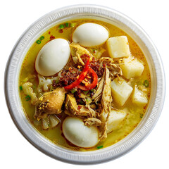 Indonesian Lontong Opor Ayam. Traditional chicken curry soup with rice cake and egg. Authentic Asian food isolated, top view.