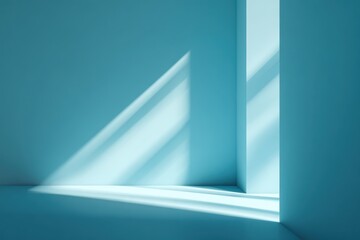 Soft light casting gentle shadows in a serene, light blue interior space with clean lines and a tranquil atmosphere during daytime