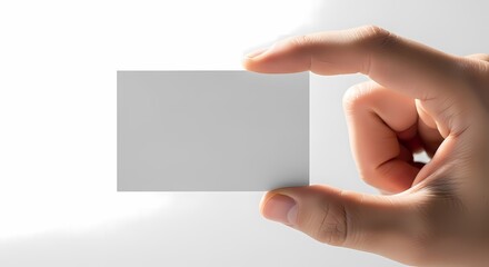 Fototapeta premium Hand Holding Blank White Card on White Background