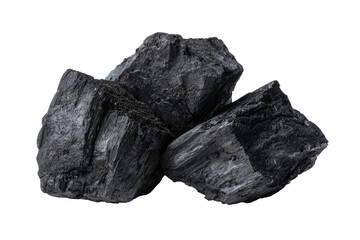 Obraz premium Dark, rough chunks of coal pile against a solid black backdrop