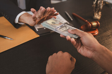 A professional lawyer discussing legal matters with a client in an office, providing legal advice...