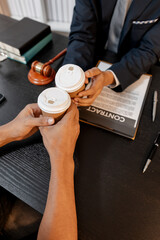 A professional lawyer discussing legal matters with a client in an office, providing legal advice and document review services, symbolizing justice, trust, and professional consultation.