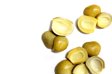 Salty pickled Ma-Muang Bao (Thai small mango) halves without seed.