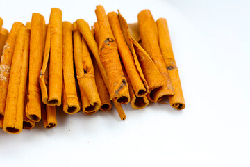 Dried cinnamon sticks arranged in a bundle.
