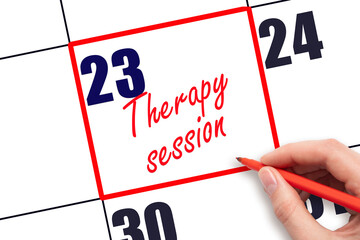 23 rd day of the month.  Hand writing Therapy session reminder and drawing red frame on calendar...