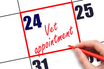24 th day of the month.  Hand writing Vet appointment reminder and drawing red frame on calendar with red pen on white background. concept of caring for pets. Planning and scheduling
