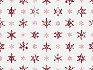 Seamless repeating pattern of snowflakes outlines of varying sizes and designs in dark maroon, on a light grey background