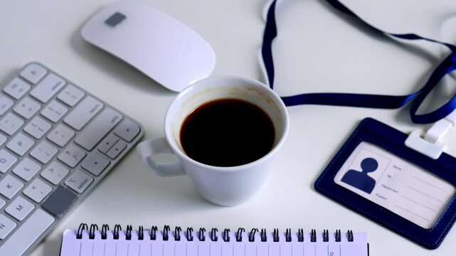 Professional office setup with coffee, keyboard, mouse, and ID badge isolated on white background