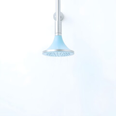 A serene blue showerhead is centrally placed on a pristine white background,
