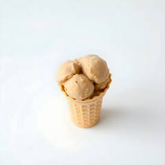A creamy brown pistachio ice-cream in a crisp waffle cone, placed on a clean and minimalist white background