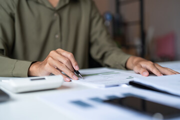 Close up of businessman hands signing or writing document paperwork and report Auditor analysis male professional hand making notes with Business Document