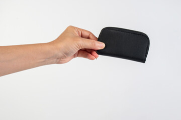 Black zippered bag in hand on white background
