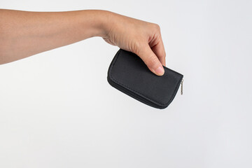 Black zippered bag in hand on white background