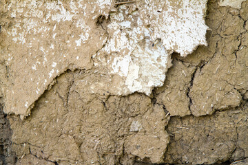 The texture of a cracked adobe wall. Old Clay Wall