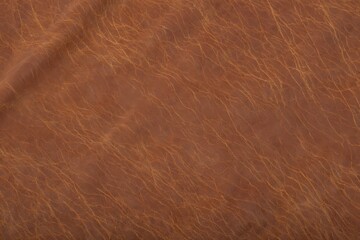 Fototapeta premium Close up of textured brown fabric with subtle patterns