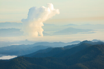 Landscape of Morning Mist with Mountain Layer. mountain ridge and clouds in rural jungle bush forest