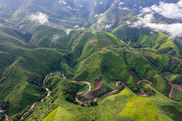 Landscape of Morning Mist with Mountain Layer. mountain ridge and clouds in rural jungle bush forest