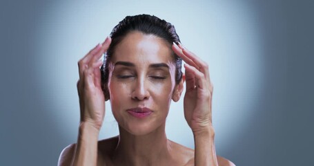 Face, mature woman and skincare in studio with smile for collagen, retinol and anti aging benefits. Confident, happy and female person with beauty, dermatology and smooth skin on grey background.