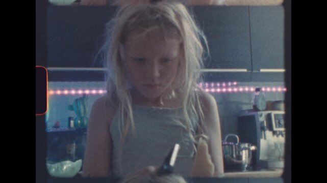 Detailed view of young girl slicing cheese onto pizza dough in cozy home kitchen shot on super 8 film with retro analog texture