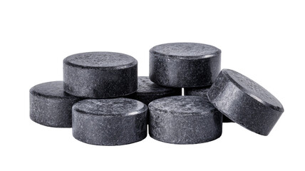 Set of black activated charcoal pills and tablets used for detox healthcare and natural medical treatment isolated on white background