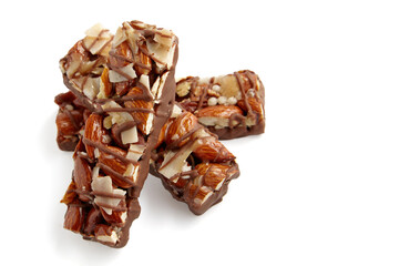 Three caramel nut bars isolated on white background