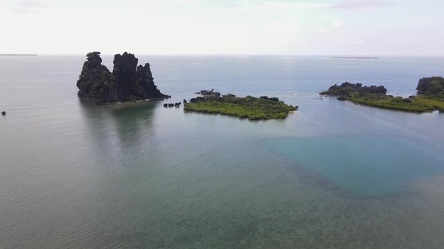 Drone aerial at La Poule in New Caledonia panning on a cloudy day