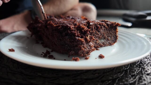 Homemade pumpkin brownie dessert eaten slowly showing texture and warmth