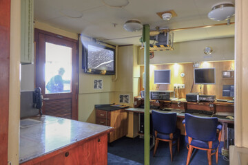 Bridge of classic ocean liner cruise ship cruiseship with nautical and technical appliances and equipment including binoculars, cameras and compass