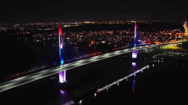 Colorful Lights At Heroes Of Chaco Bridge At Nighttime In Paraguay, South America. Aerial Drone Shot