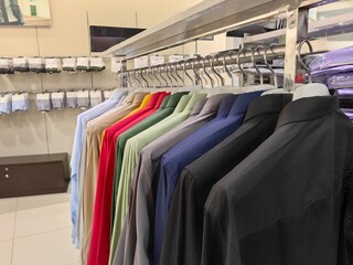 Obraz premium clothes on hangers in shop