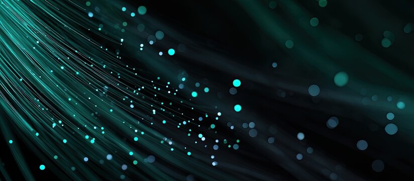 Abstract graphic features teal streaks of light and scattered glowing circles against a dark background