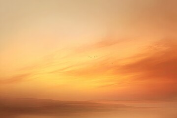 Fototapeta premium Sunset sky with soft, warm colors and small birds flying in the distance