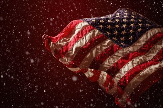 American flag waving with stars and stripes amid falling snow against a rich, dark red backdrop