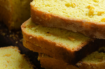 Homemade cornbread slices on kitchen table zoomed image