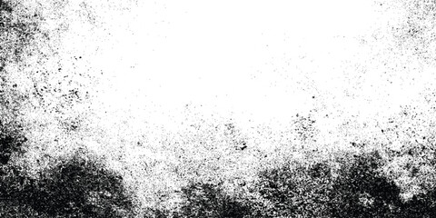 Grunge black and white distressed texture with scattered speckles and blotches for abstract background or overlay design.