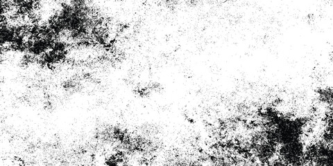 Grunge black and white distressed texture with scattered speckles and blotches for abstract background or overlay design.