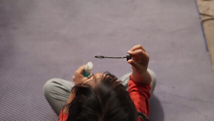 Little Girl Blowing Soap Bubbles Outdoors on a Sunny Day