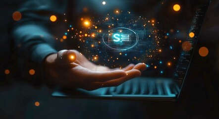 Hand presenting glowing digital particles and technological symbols hovering above an open laptop keyboard in a dark setting