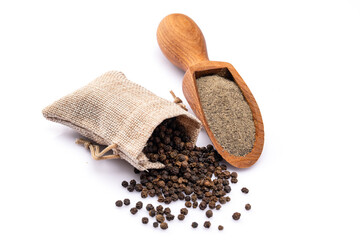 Black peppercorns and ground black pepper powder on white background	
