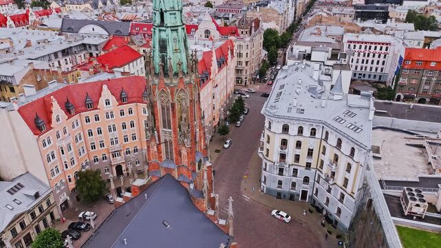 Cinematic drone shot Old St Gertrude Lutheran Church Riga Latvia historic urban