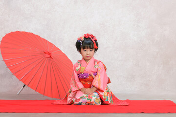 Fototapeta premium Shichi-Go-San Portrait – Little Girl in Pink Kimono Sitting 